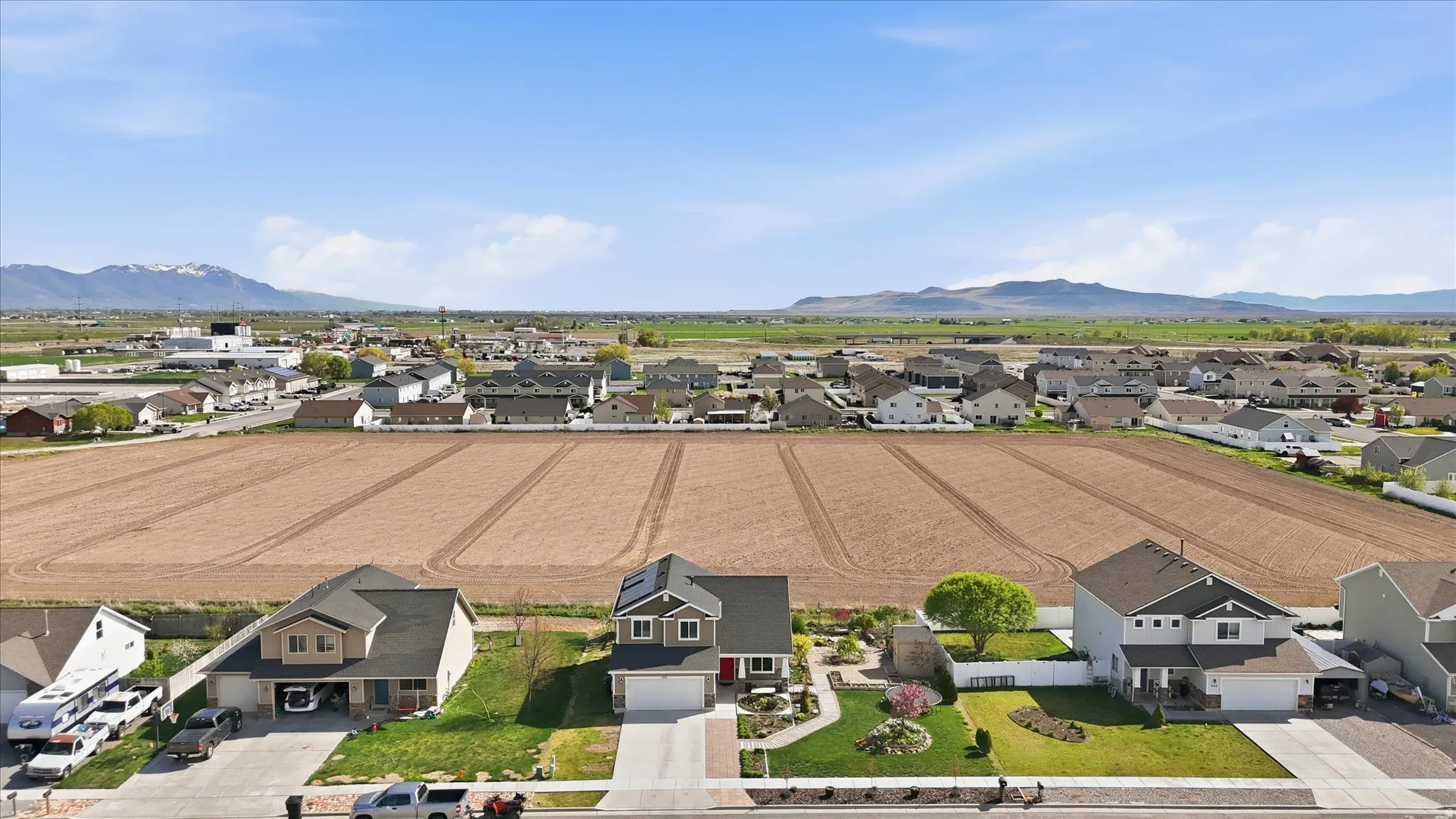 Aerial view of residential area featuring mountains