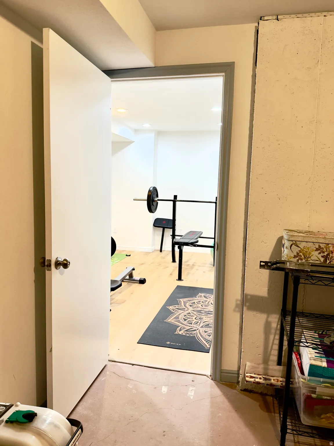 Workout area with concrete floors and recessed lighting