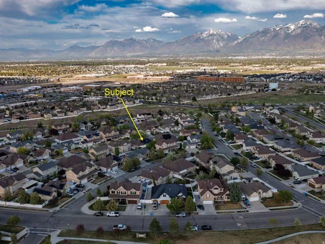 Aerial perspective of suburban area featuring a mountain backdrop