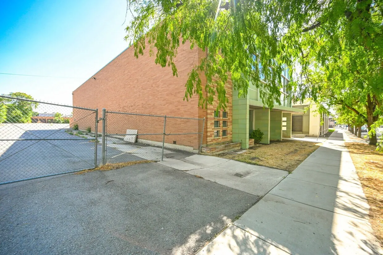 View of side of home featuring a gate