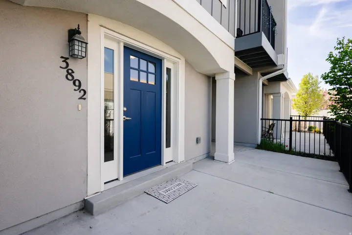 Entrance to property featuring stucco siding
