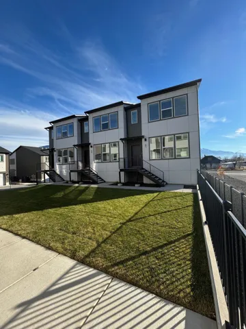 Rear view of house featuring a residential view and a mountain view