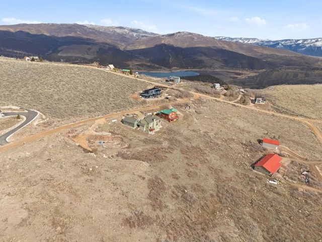 Aerial overview of property's location with mountains and rural landscape