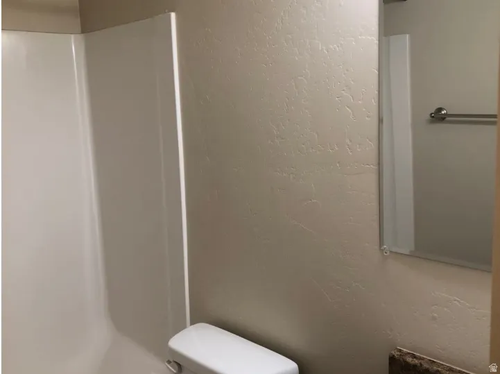 Bathroom with a textured wall