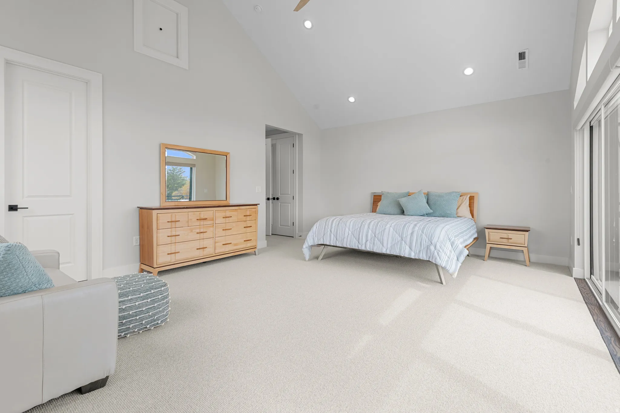 Bedroom featuring light colored carpet, recessed lighting, lofted ceiling, ceiling fan, and access to exterior