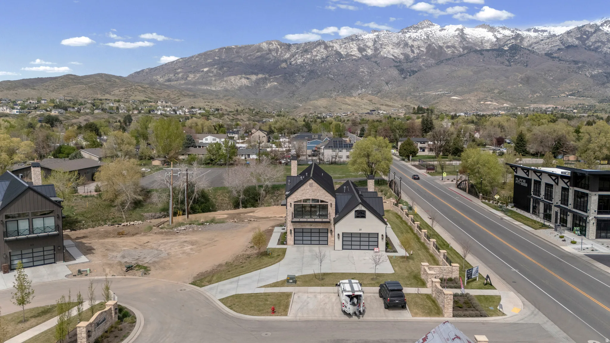 Aerial view of residential area with a mountainous background