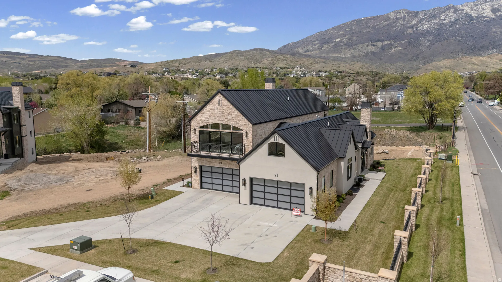 Aerial perspective of suburban area featuring a mountain backdrop