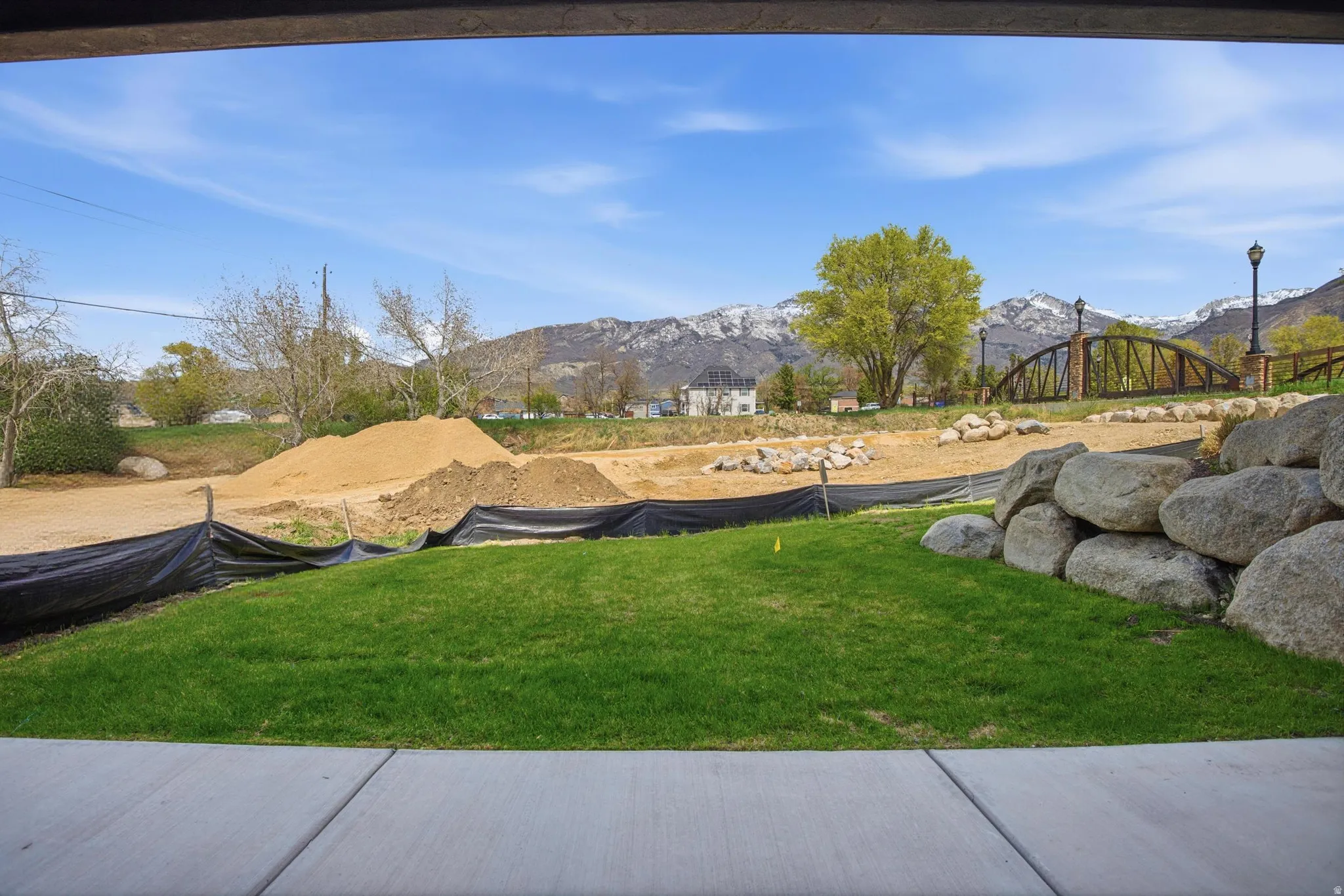 View of green lawn with a mountain view