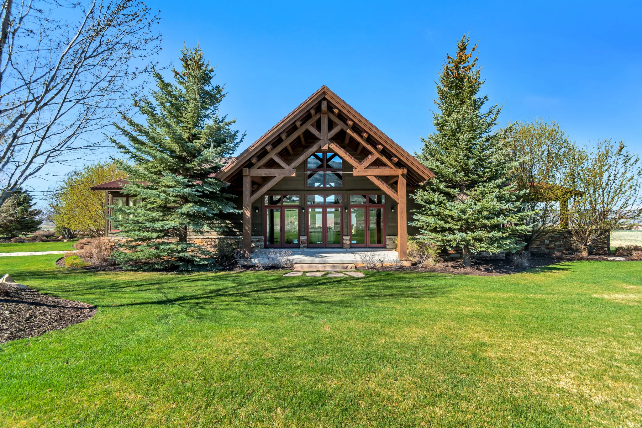Rear view of house featuring a lawn