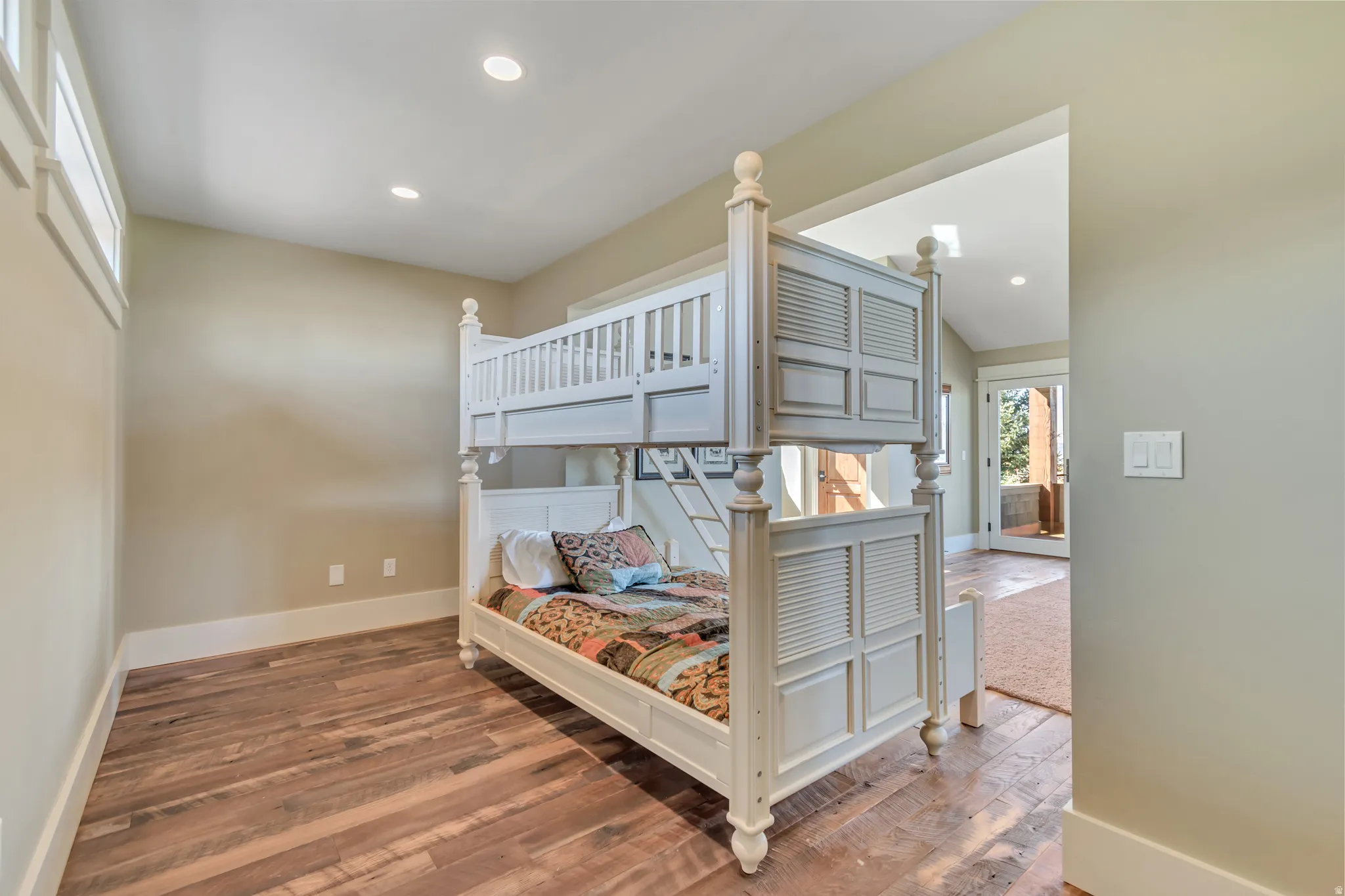Bedroom with hardwood / wood-style flooring and recessed lighting