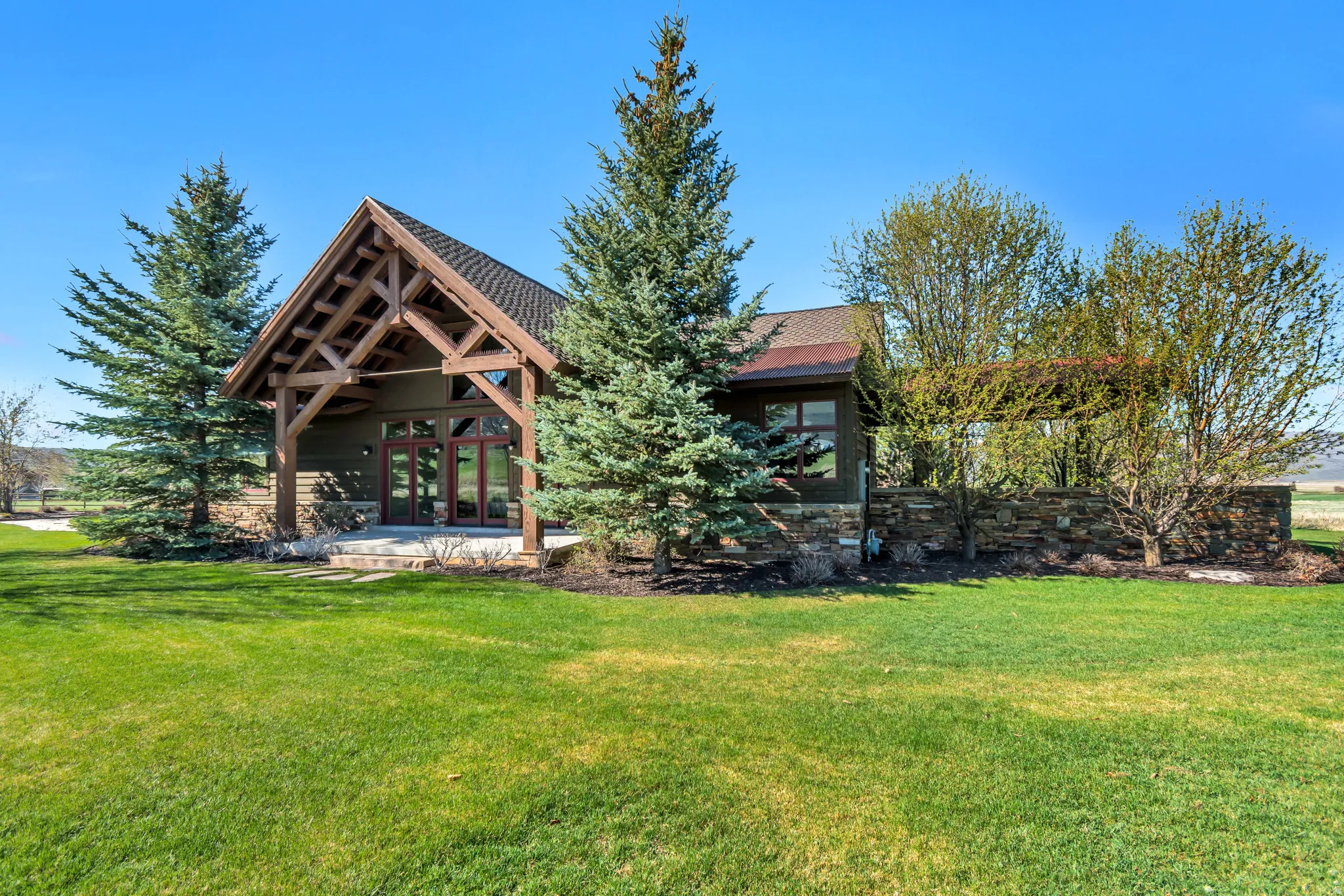 Back of house with a yard, a patio area, and french doors