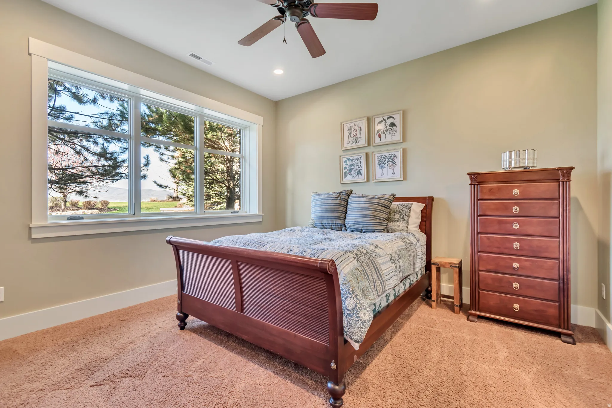 Bedroom with ceiling fan, light colored carpet, and recessed lighting