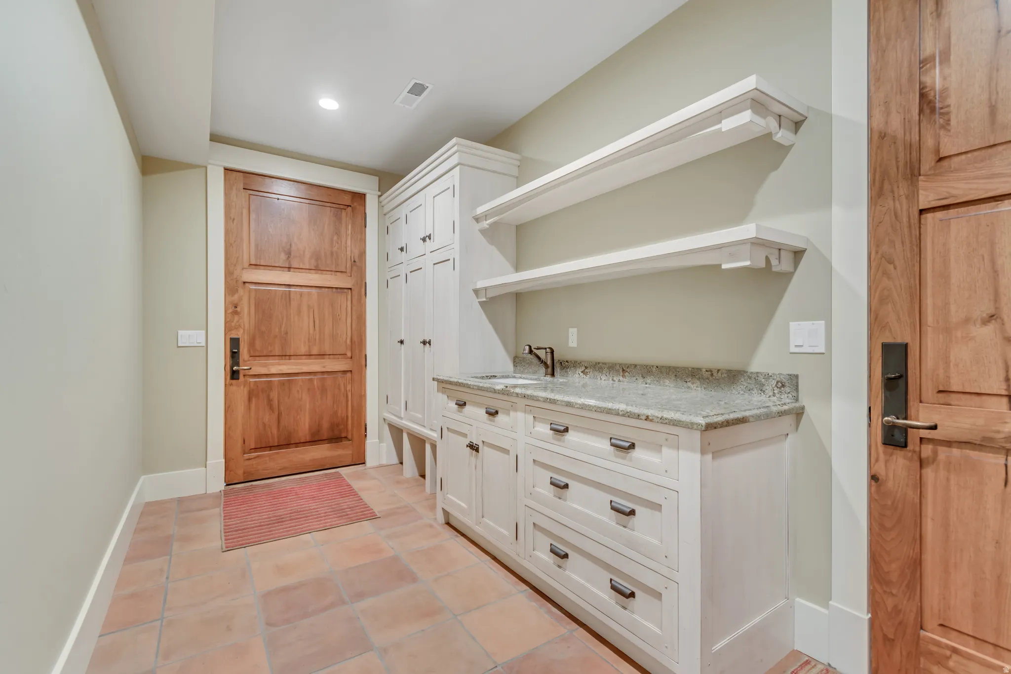 Mudroom featuring light tile patterned floors and recessed lighting