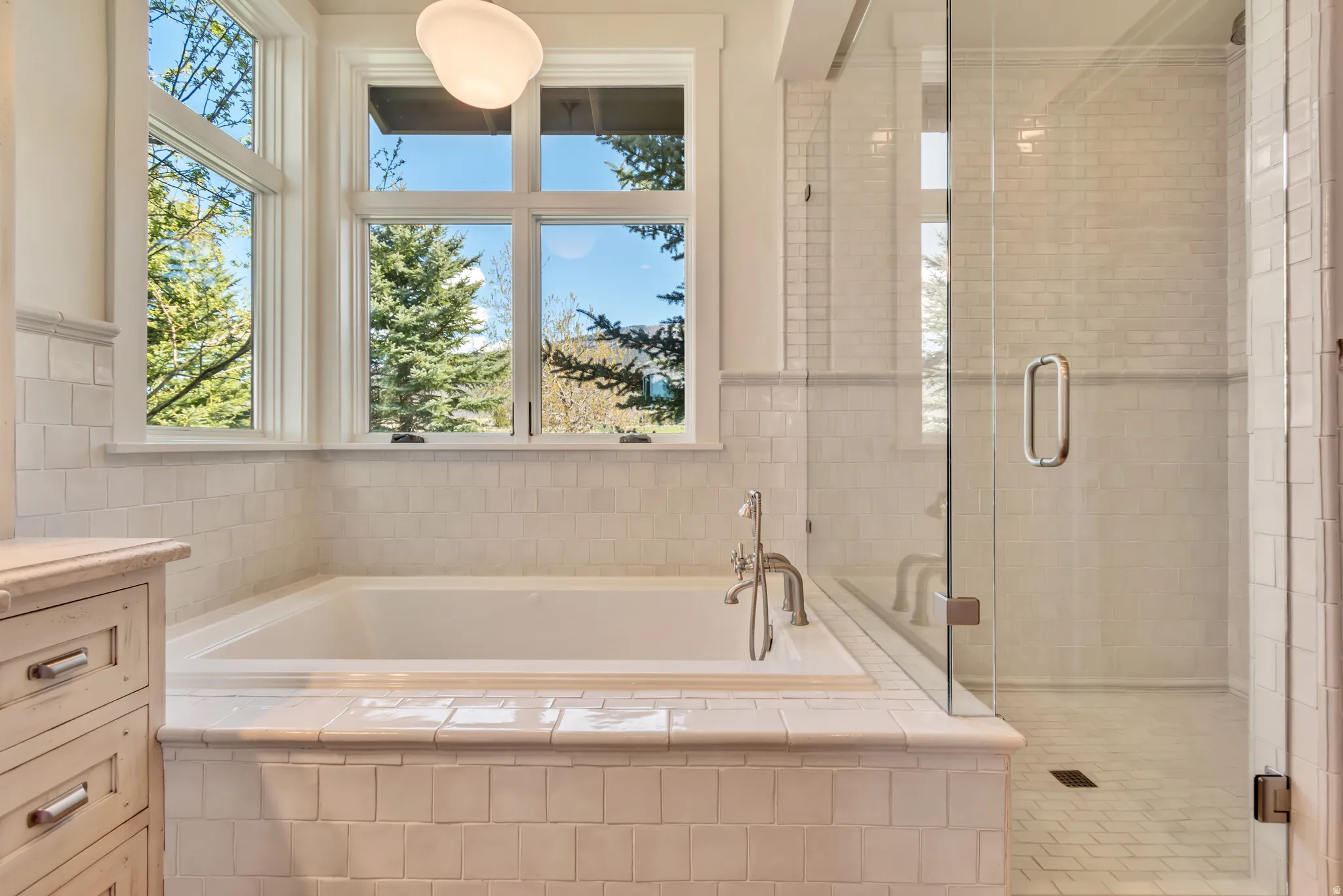 Full bath with a garden tub, a shower stall, and vanity