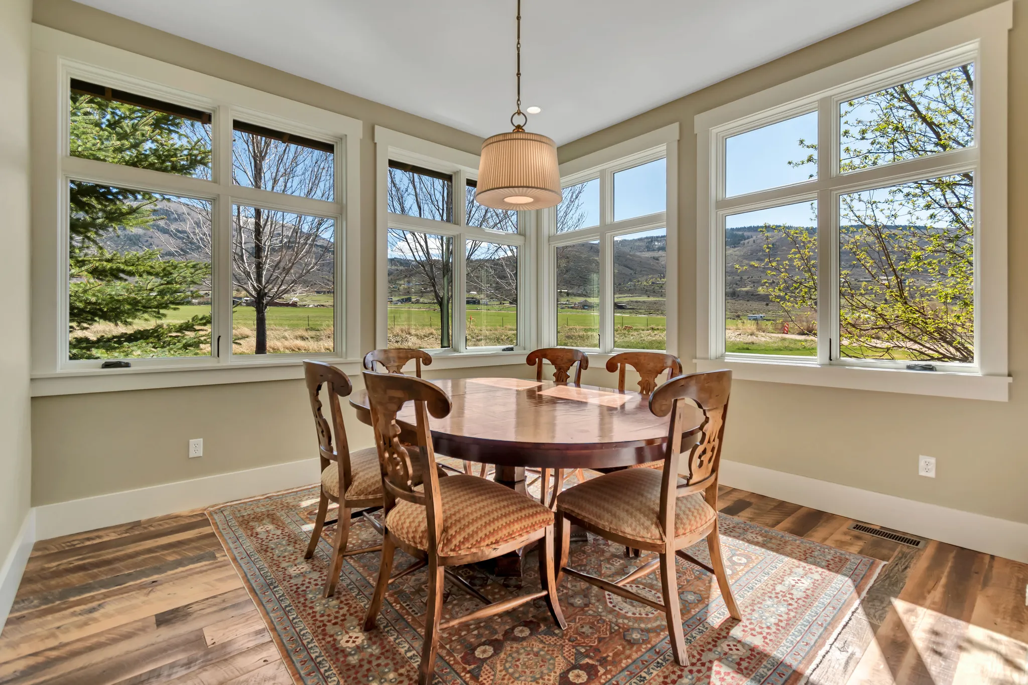 Dining area featuring a mountain view and wood-type flooring