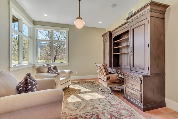Office with baseboards and recessed lighting
