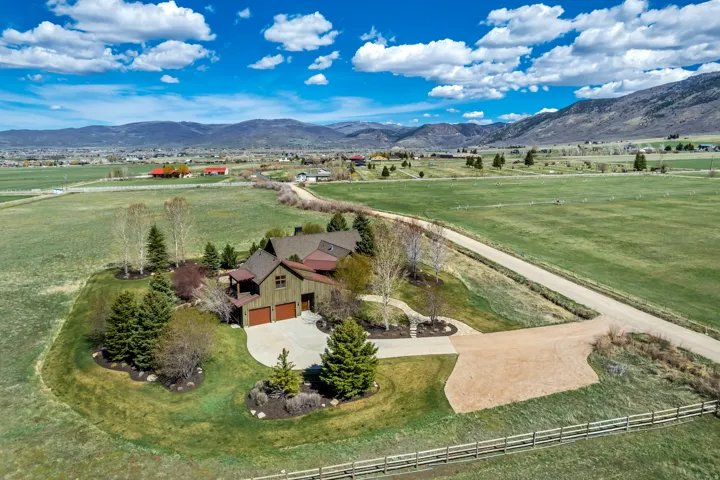 Aerial view of sparsely populated area featuring a mountain backdrop
