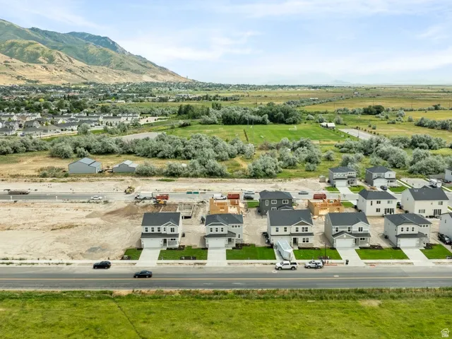 New construction homes featuring contemporary architectural styles and attached garages