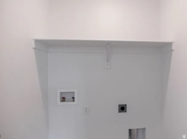 Laundry area with hookup for a washing machine and hookup for an electric dryer