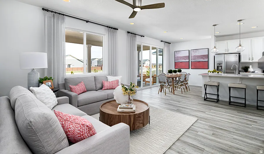 Living room with ceiling fan, recessed lighting, and light wood-style floors