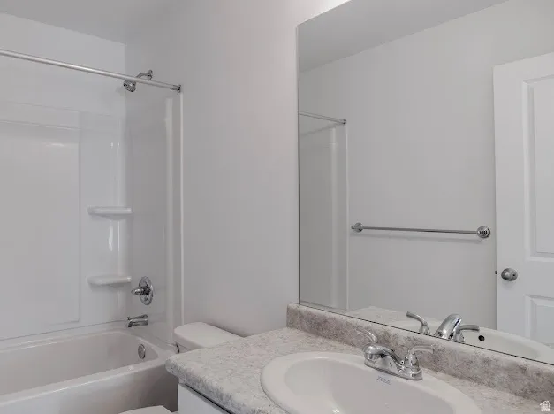 Bathroom with vanity and  shower combination