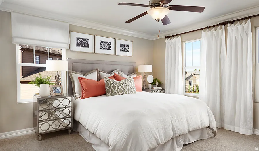 Bedroom featuring carpet flooring, crown molding, and ceiling fan