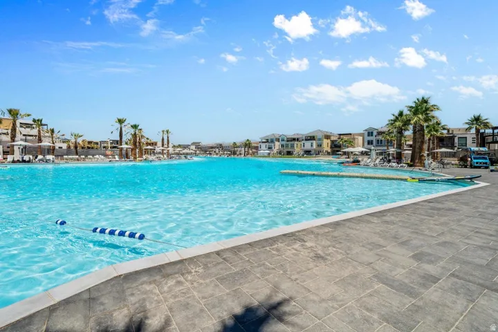 Community pool with a residential view