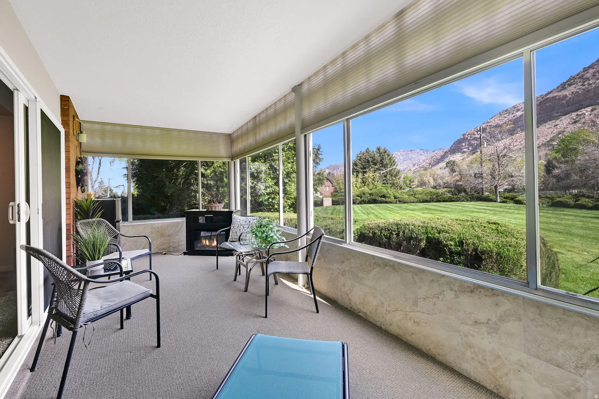 Sunroom featuring a mountain view