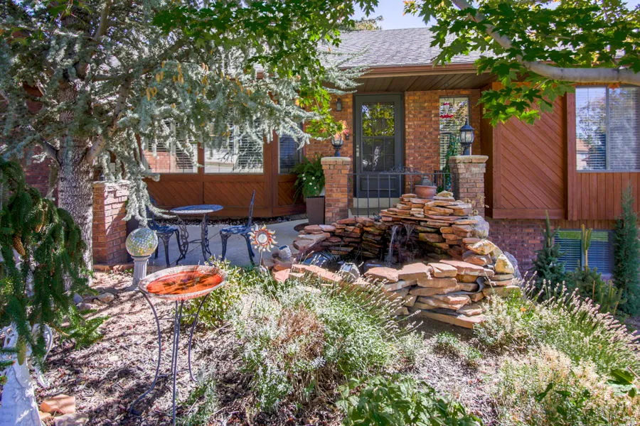 Home is tasteful brick and cedar accents. Mature trees, and outdoor lighting