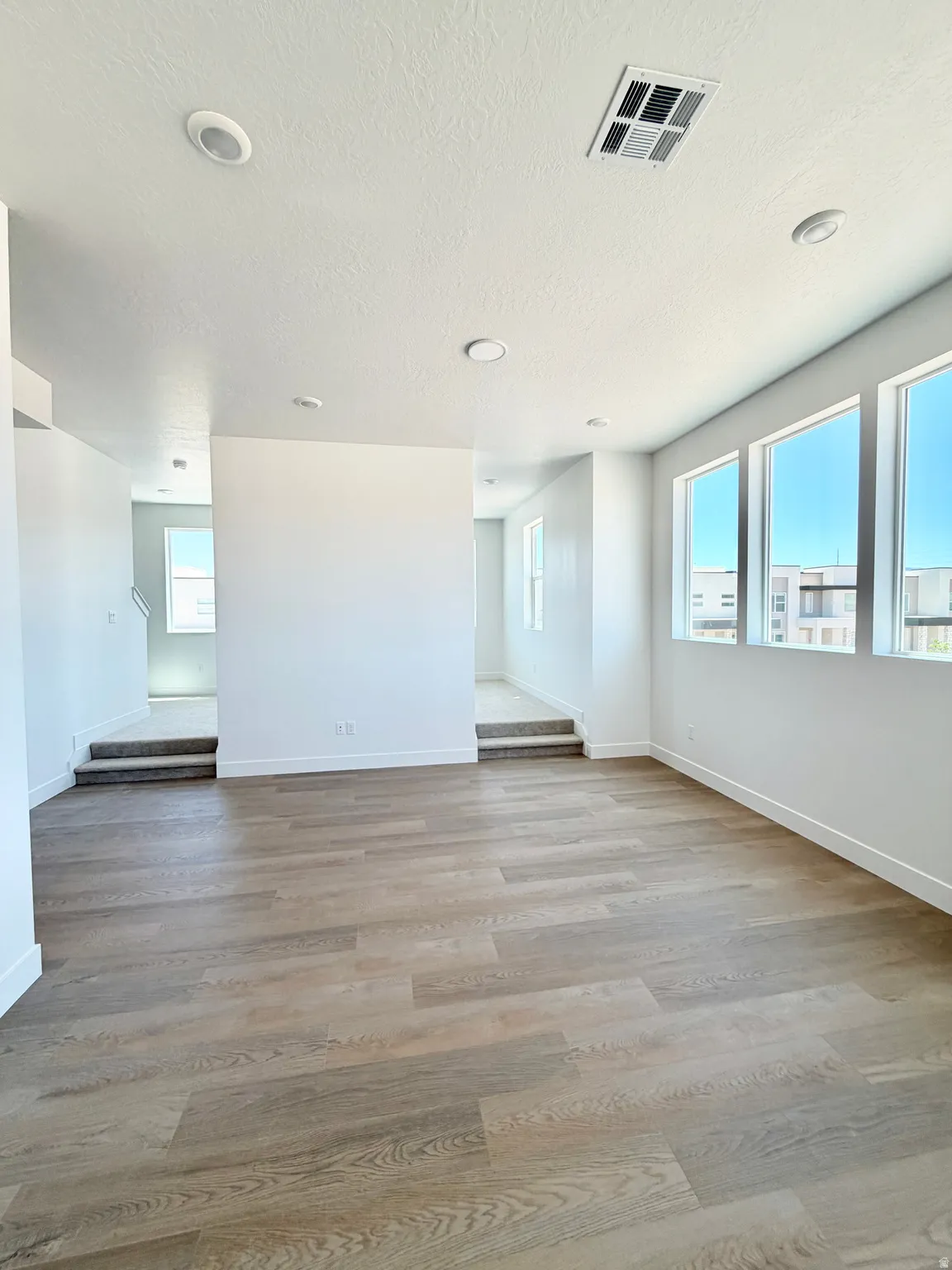 Spacious open area looking towards formal living room