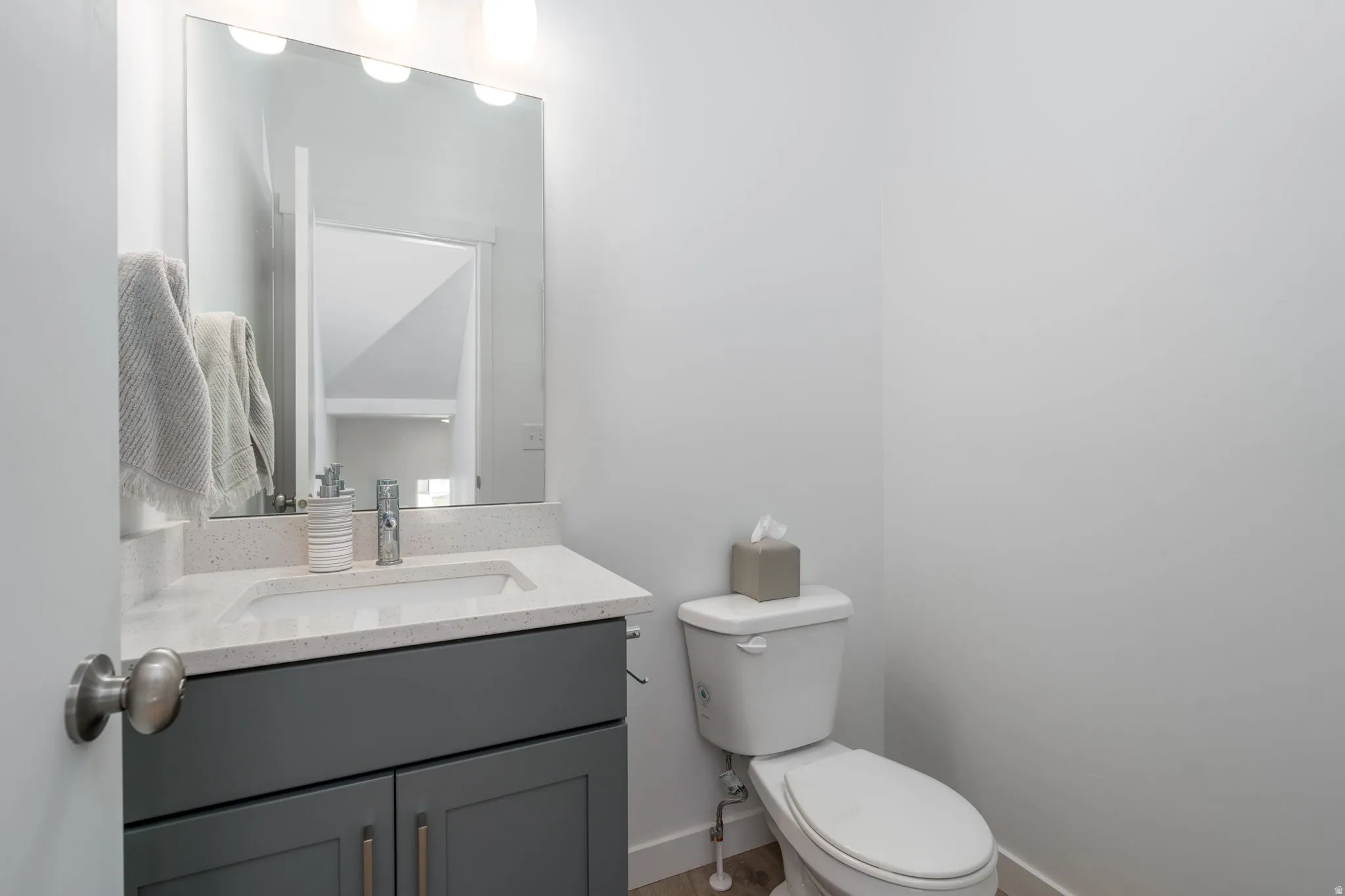 Half bath with vanity and toilet