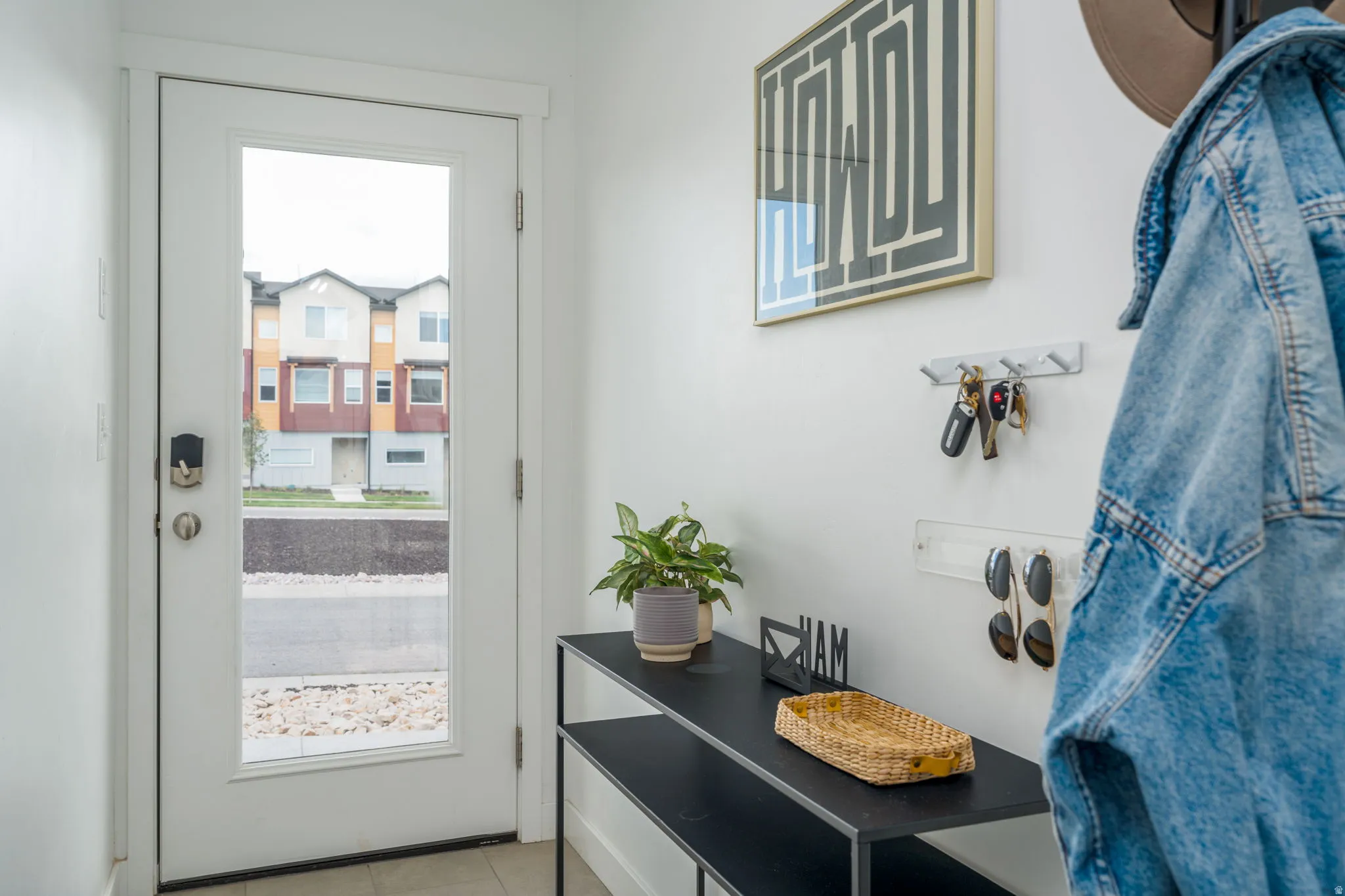 Doorway featuring tile patterned flooring