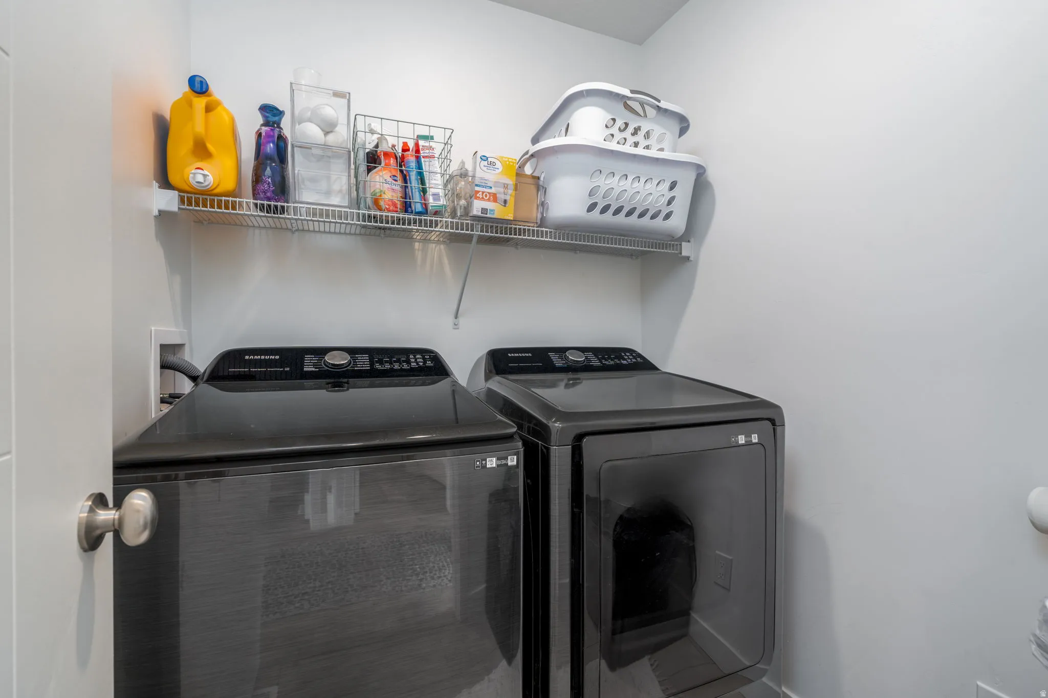 Laundry area with washer and clothes dryer