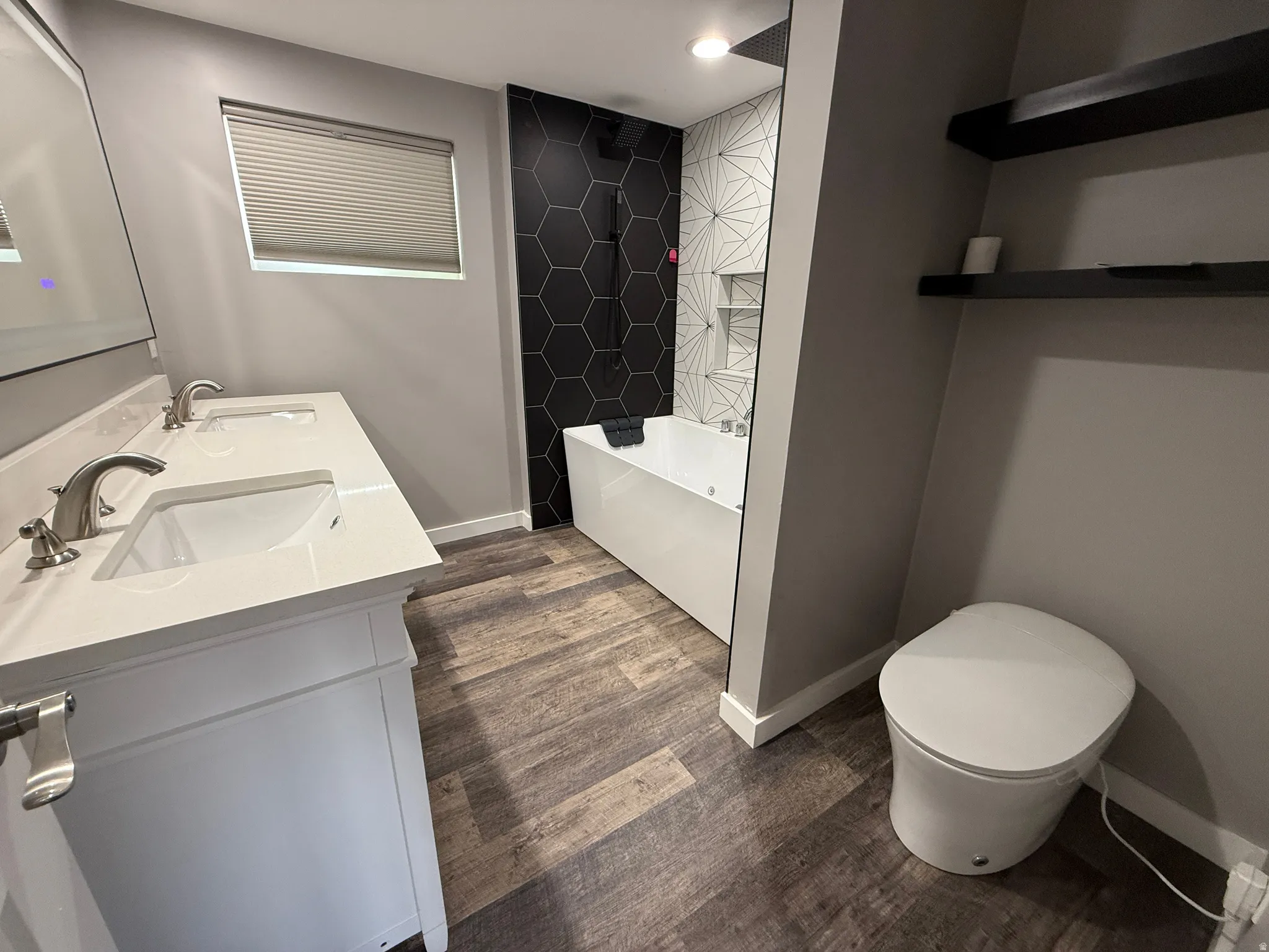 Master bedroom with double vanity, dark wood-type flooring, and a combined bath / shower with rainfall shower