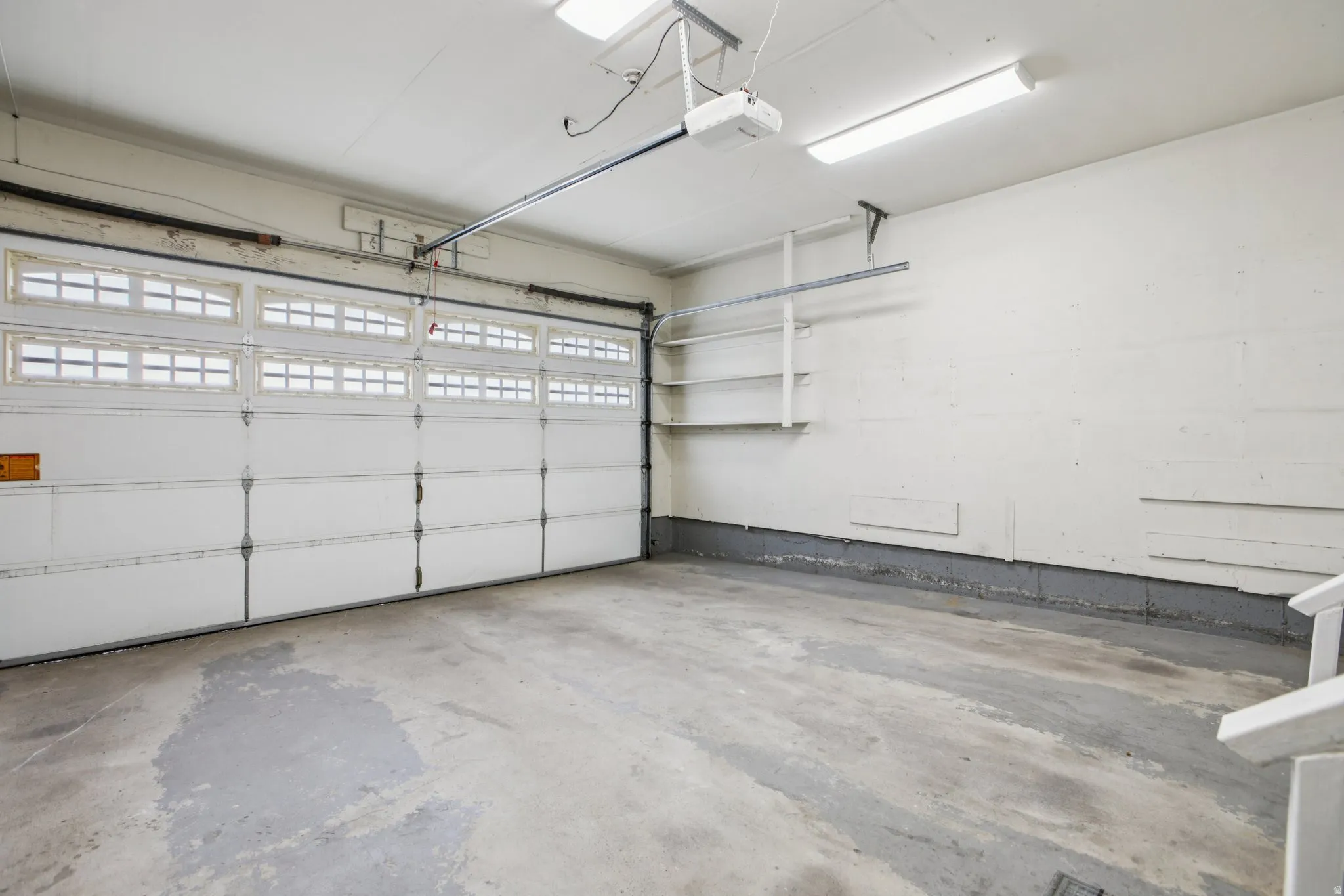 Garage featuring a garage door opener