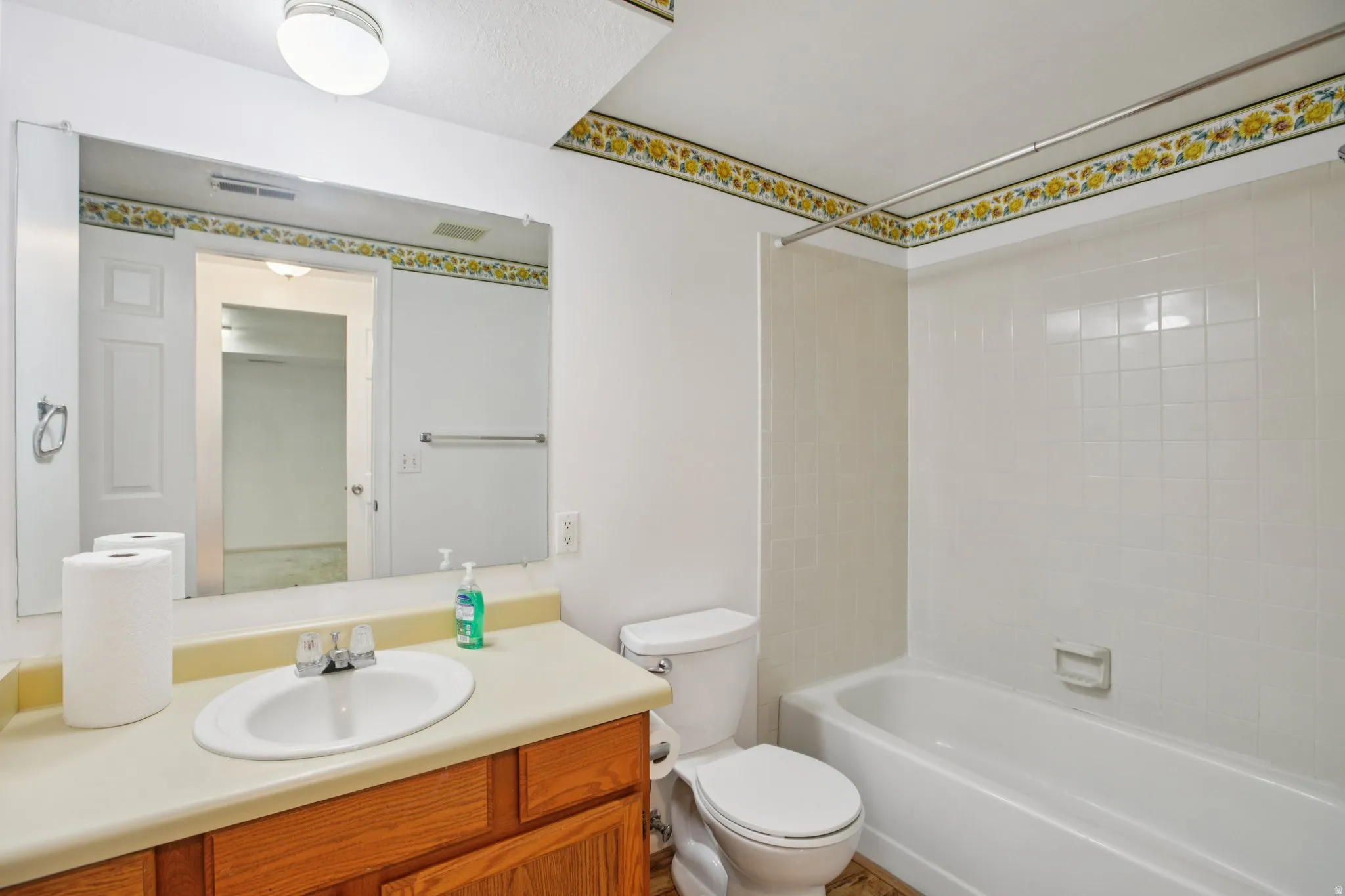 Bathroom with vanity and  shower combination