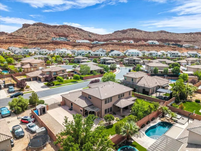 Aerial perspective of suburban area with a mountainous background