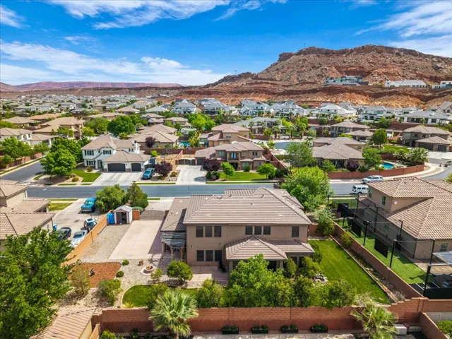 Aerial view of residential area featuring a mountainous background