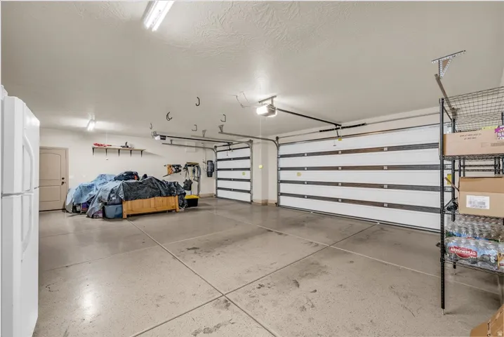 Garage with freestanding refrigerator