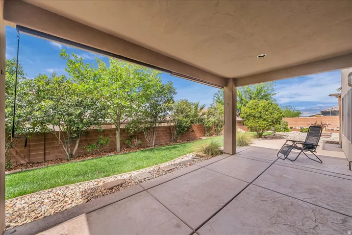 Fenced backyard featuring a patio