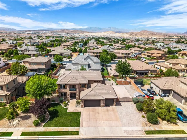 Aerial perspective of suburban area featuring a mountainous background