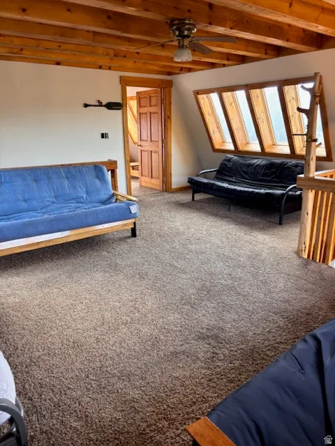 Carpeted bedroom featuring a ceiling fan