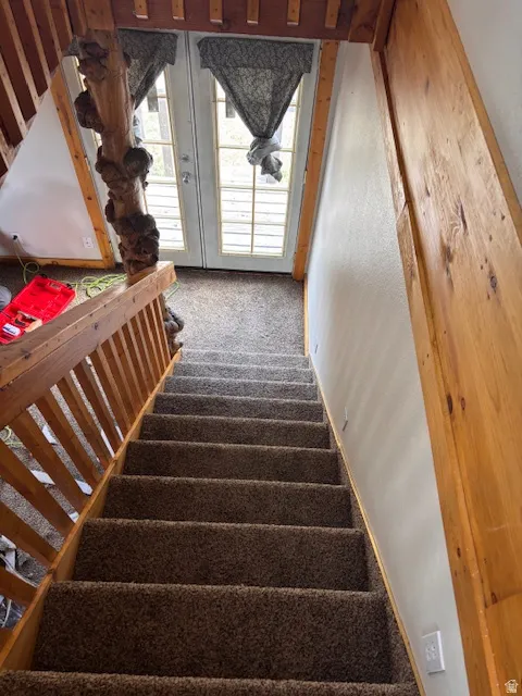 Stairway featuring carpet