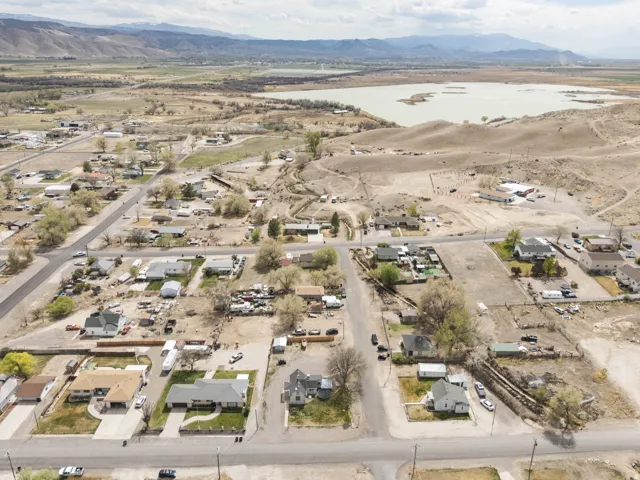 Aerial perspective of suburban area with a water and mountain view and a desert landscape