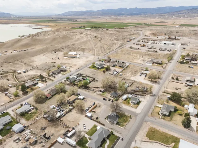 View of property location featuring nearby suburban area and rural landscape