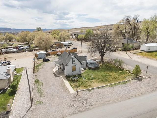 Aerial perspective of suburban area featuring a mountainous background