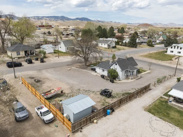 Aerial perspective of suburban area featuring a mountain backdrop