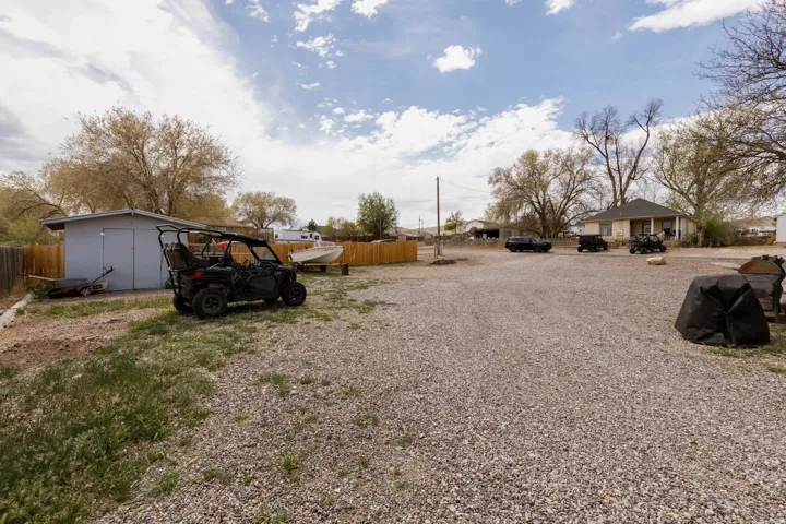 View of yard with a storage shed