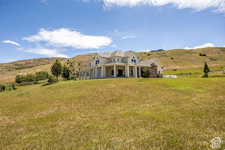 Expansive residence featuring a multi-level design and columned front porch