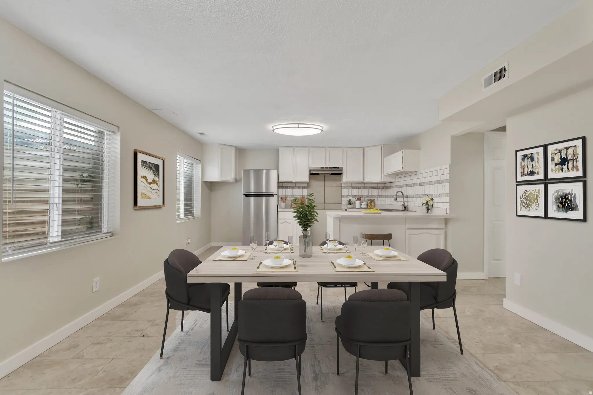 Dining area featuring light tile patterned flooring